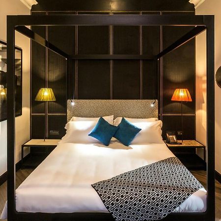 The H'All Tailor Suite Roma Exterior foto A room at the hotel