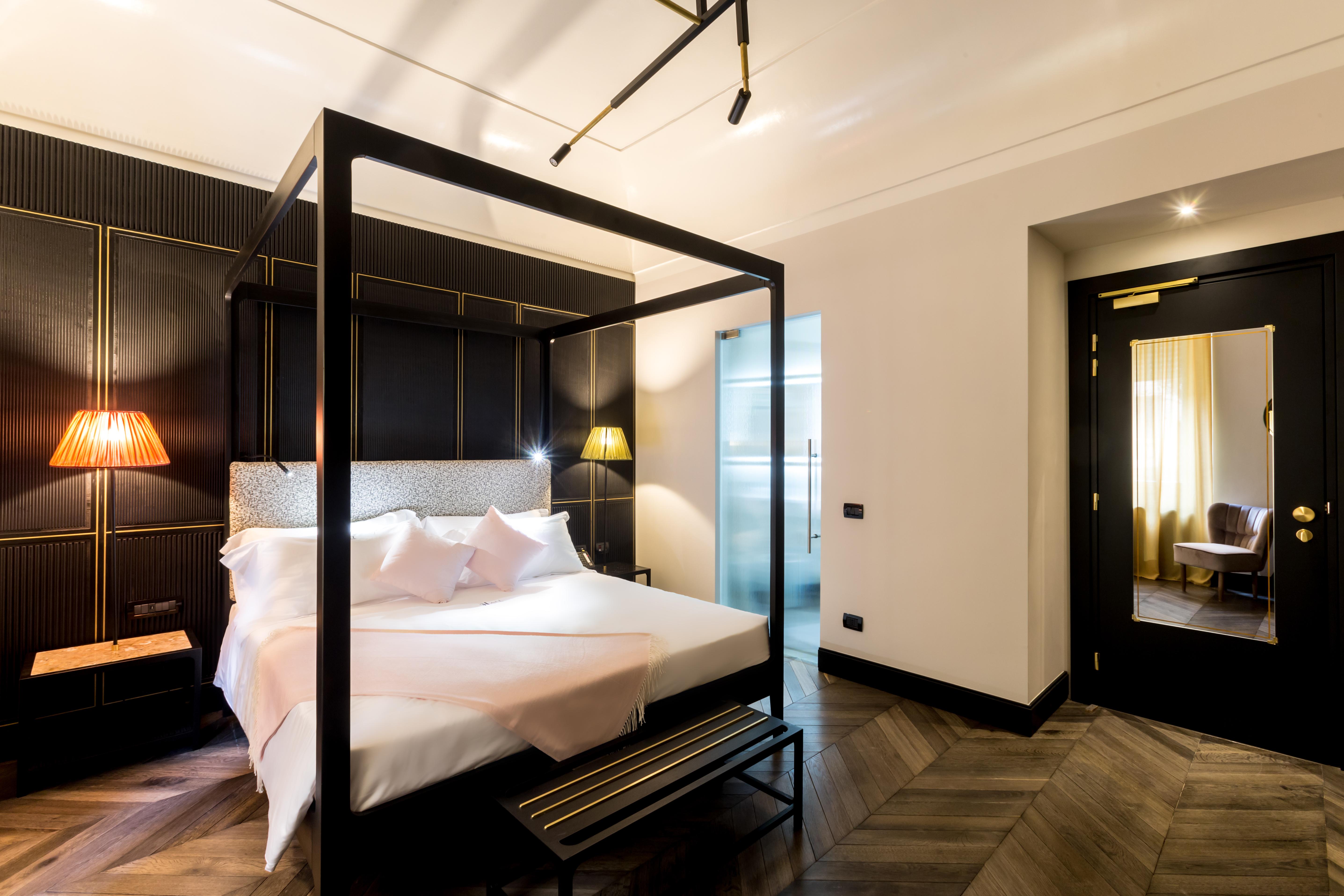The H'All Tailor Suite Roma Exterior foto A bedroom at the hotel